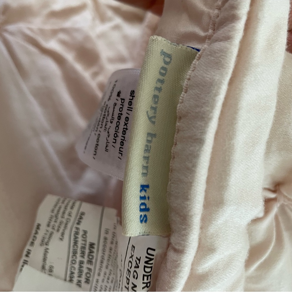 Pottery barn twin comforter and Monique Lhuillier bed skirt. Blush pink.